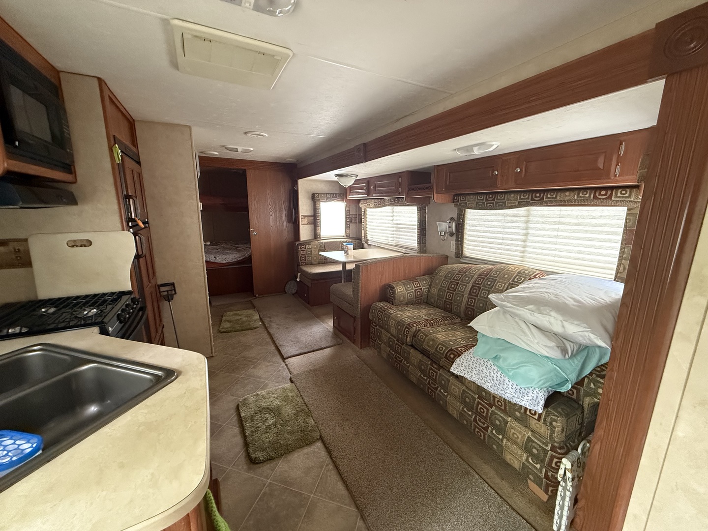 21-191 Woodhaven Lakes Sublette, IL 61367 - Photo 8 of 22 a living room with a couch and a flat screen tv