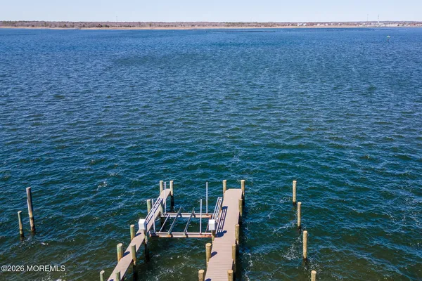 a picture of a bathroom with a sink and a mirror