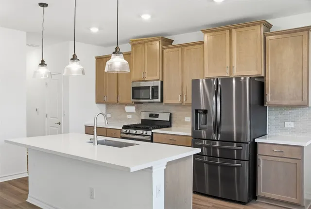 a kitchen with a sink and window