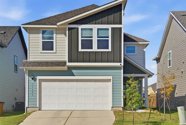 a front view of a house with a garage