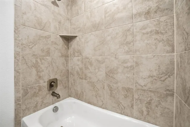 a bathroom with a double vanity sink and mirror
