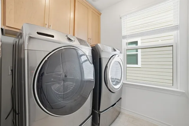 a white toilet sitting next to a white wall