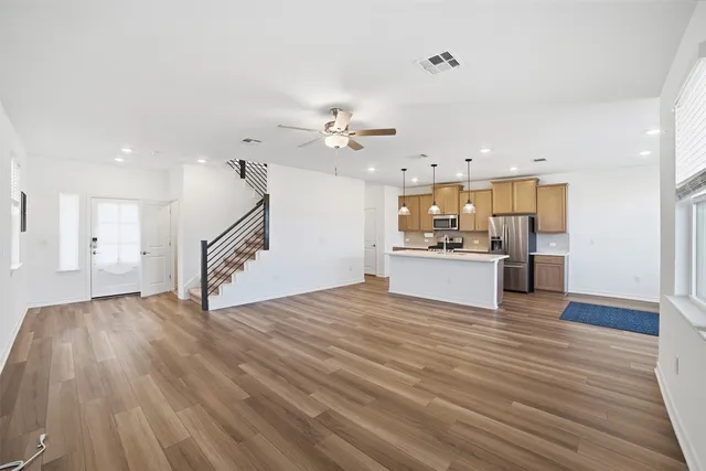 a view of a kitchen with a sink and a living room