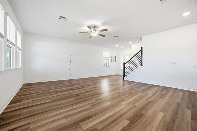 a view of kitchen with cabinets and wooden floor