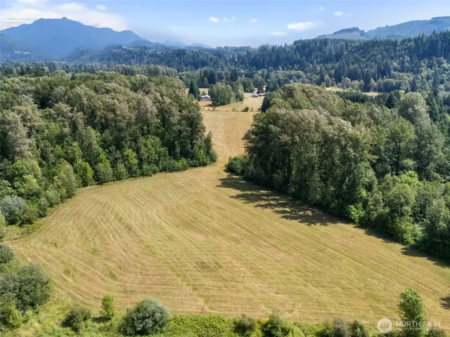 an aerial view of a yard with swimming pool