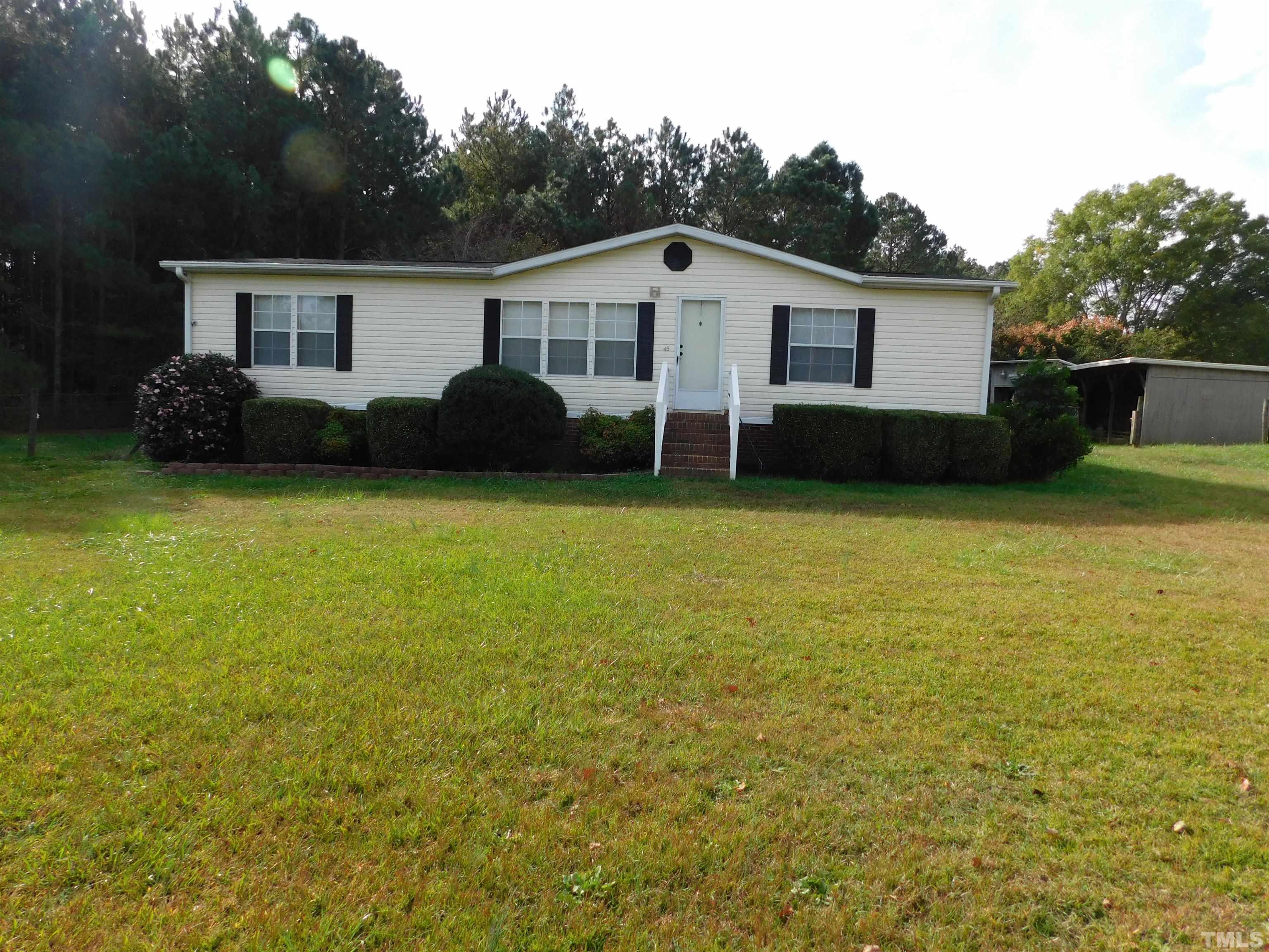 45 Ray-Denton Road Spring Hope, NC 27882 - Photo 1 of 13 a view of a house with patio and garden