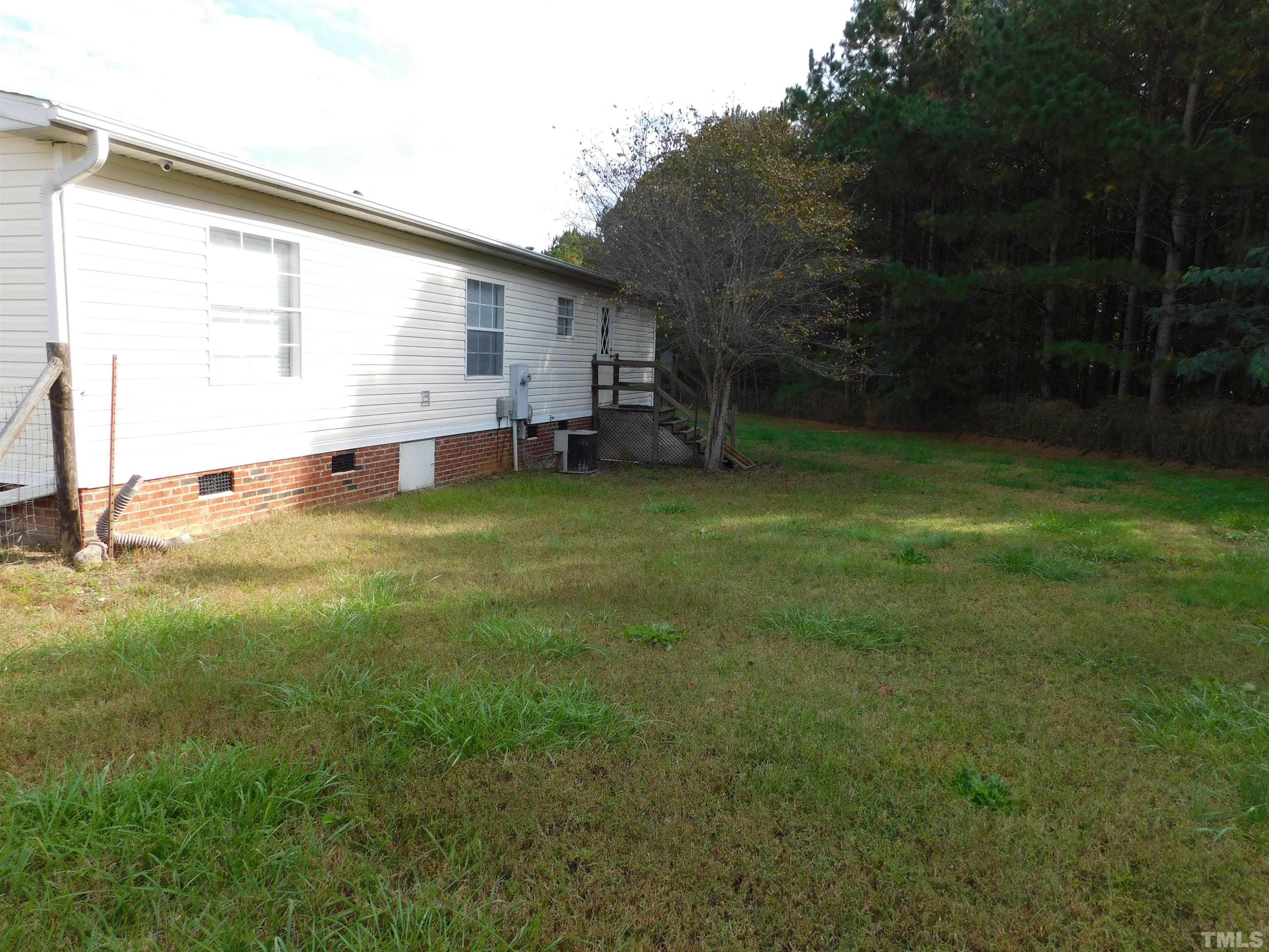 45 Ray-Denton Road Spring Hope, NC 27882 - Photo 13 of 13 a view of a backyard with a garden and entertaining space
