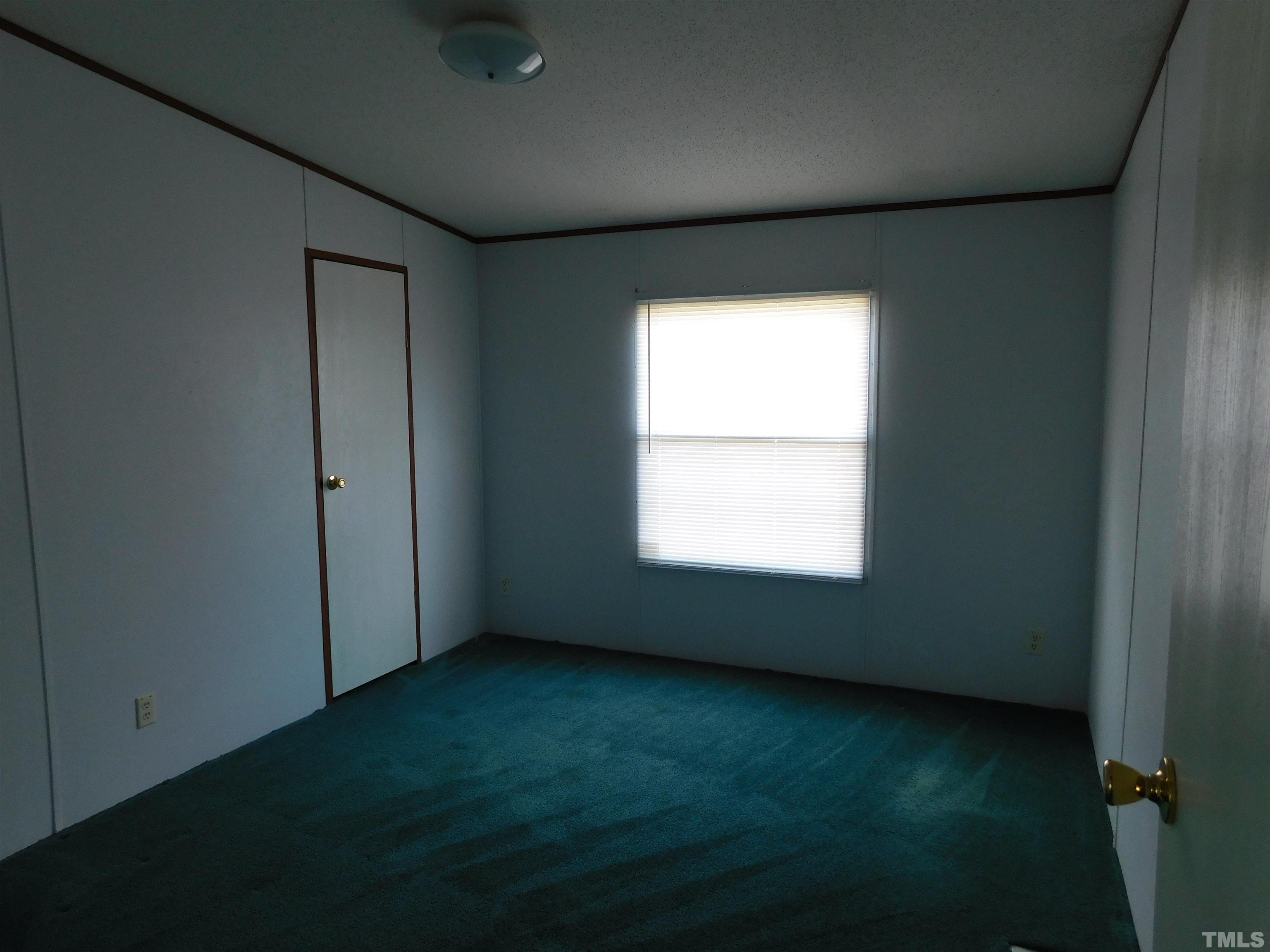 45 Ray-Denton Road Spring Hope, NC 27882 - Photo 3 of 13 an empty room with a window