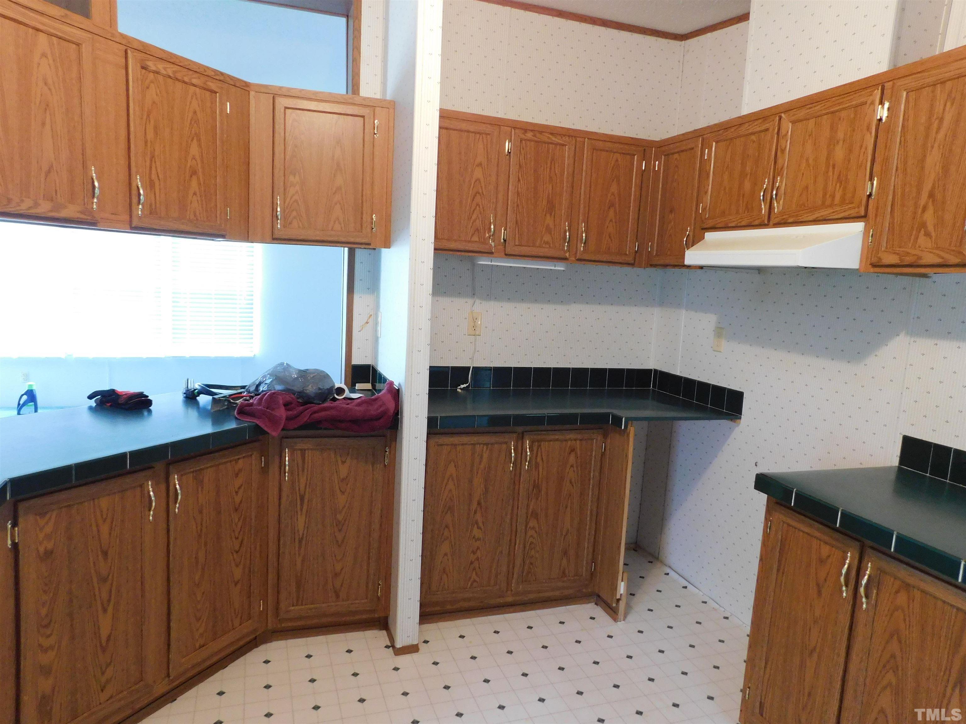 45 Ray-Denton Road Spring Hope, NC 27882 - Photo 5 of 13 a kitchen with stainless steel appliances a refrigerator and a sink
