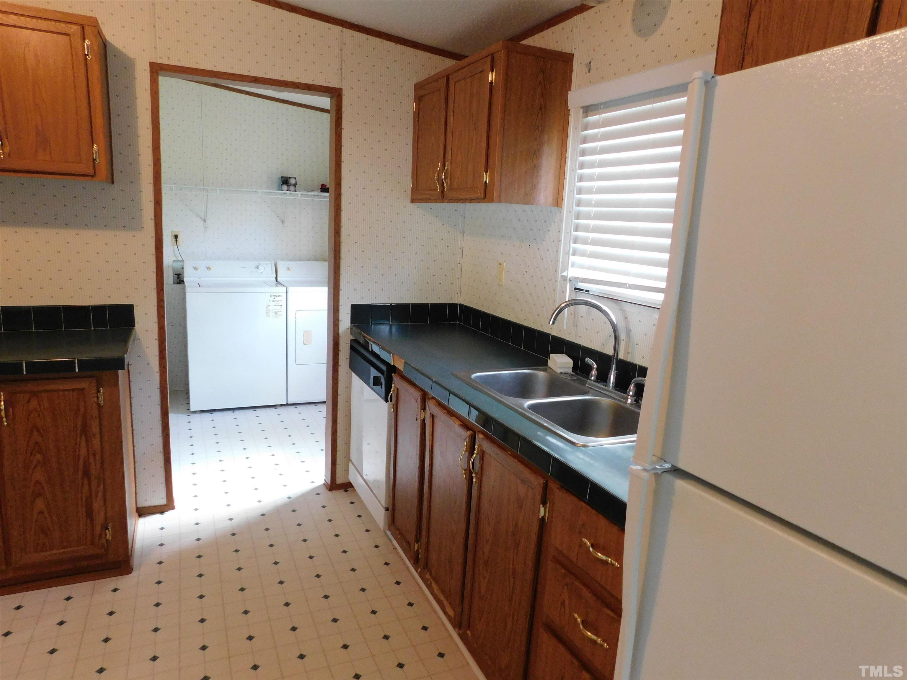 45 Ray-Denton Road Spring Hope, NC 27882 - Photo 6 of 13 a kitchen with granite countertop a sink and a stove top oven