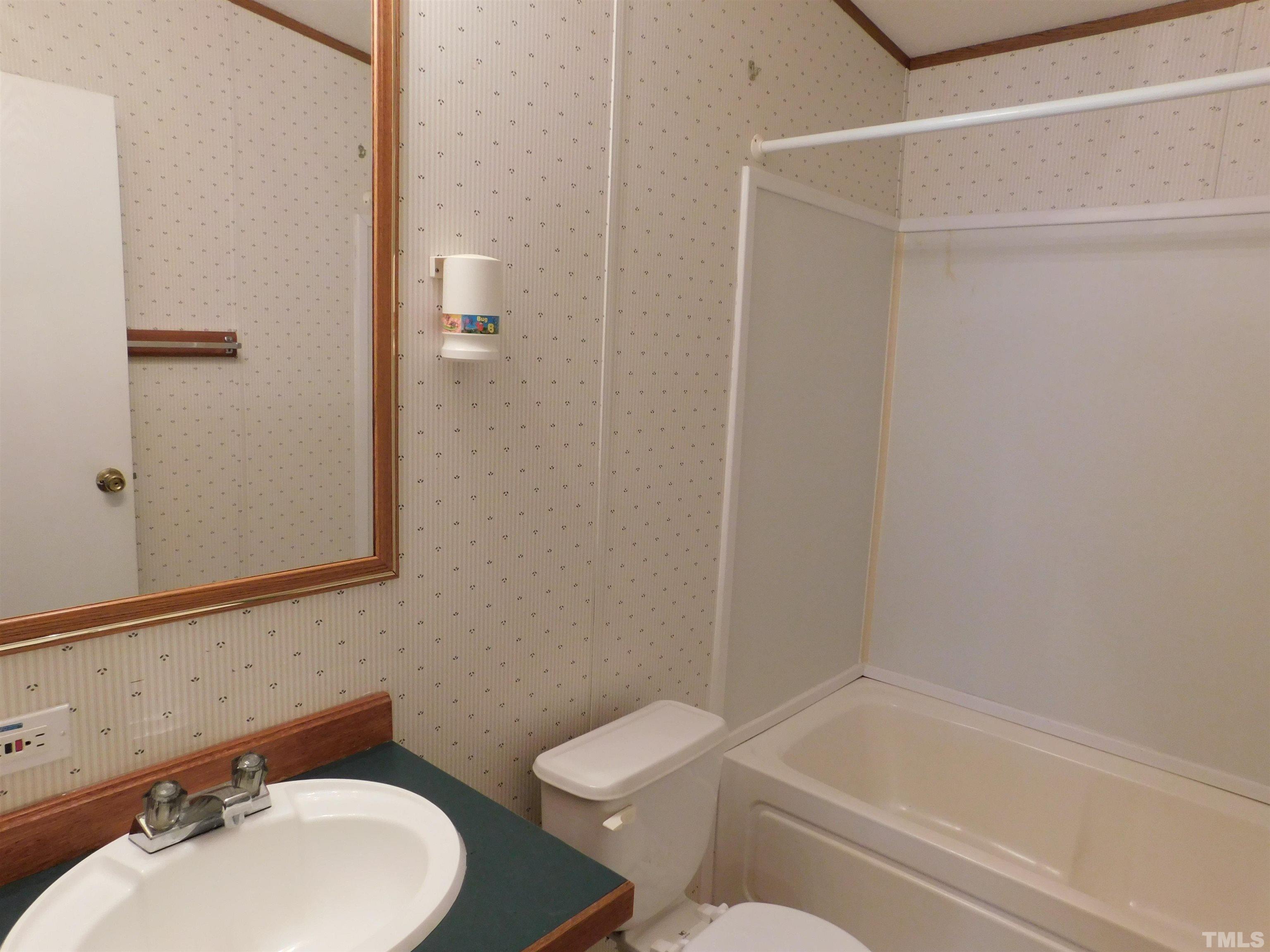 45 Ray-Denton Road Spring Hope, NC 27882 - Photo 9 of 13 a bathroom with a sink toilet and shower