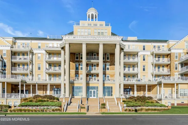 a front view of a building with a lot of windows