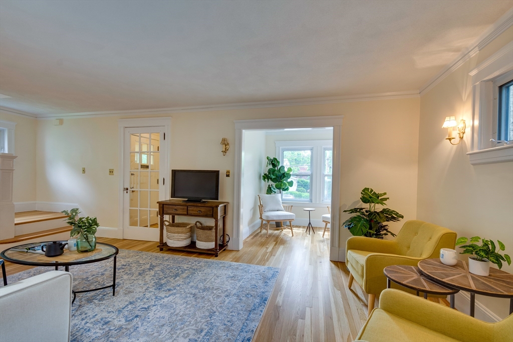 74 Ronald Road Arlington, MA 02474 - Photo 8 of 29 a living room with furniture and a flat screen tv