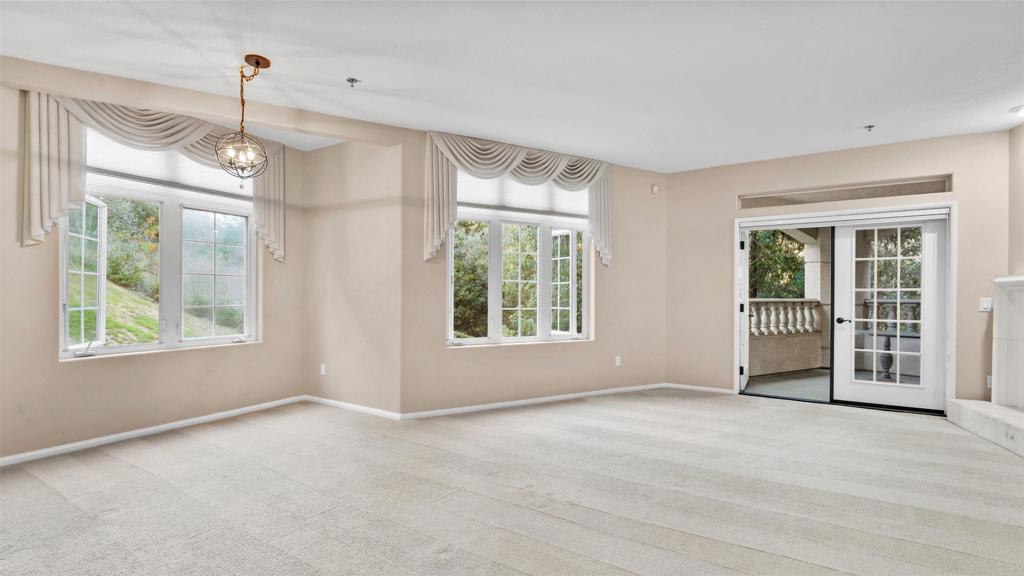 2894 Torrey Pines Road La Jolla, CA 92037 - Photo 11 of 46 a view of livingroom with window ceiling fan and front door