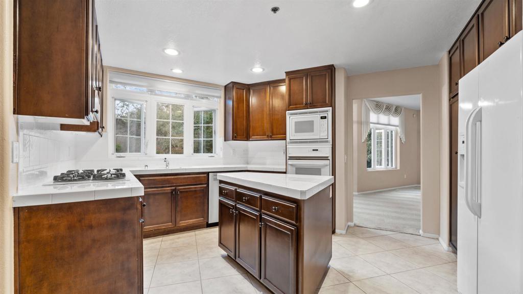 2894 Torrey Pines Road La Jolla, CA 92037 - Photo 15 of 46 a kitchen with a sink stove and refrigerator