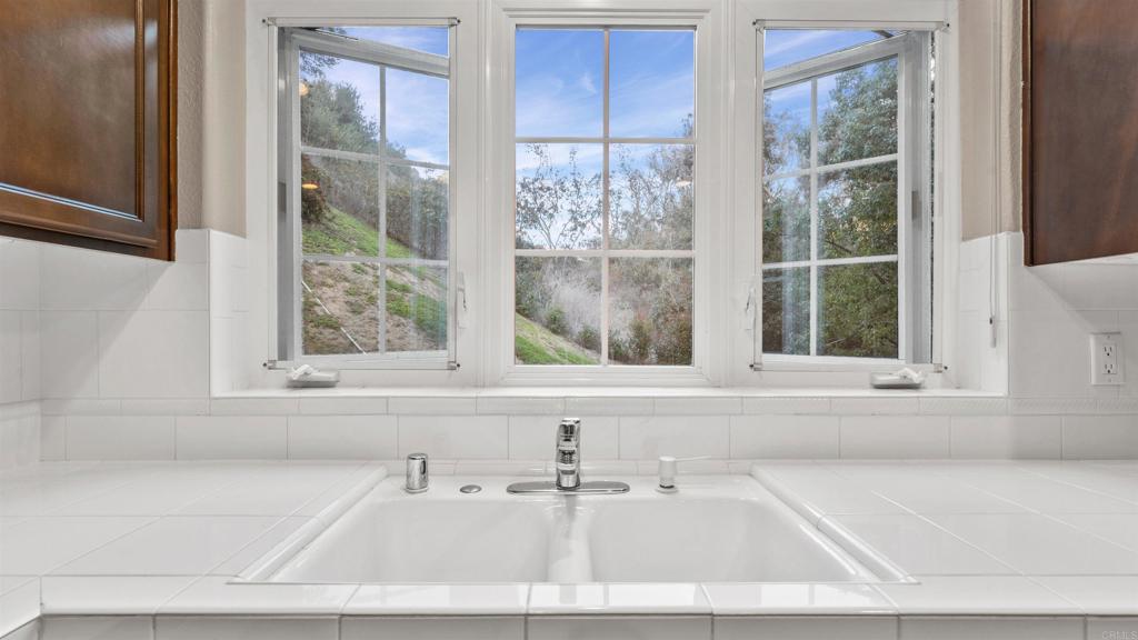 2894 Torrey Pines Road La Jolla, CA 92037 - Photo 17 of 46 a bathroom with a bathtub and window