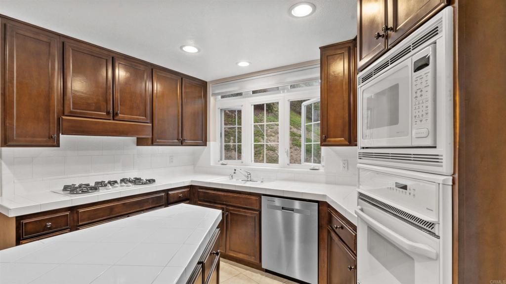 2894 Torrey Pines Road La Jolla, CA 92037 - Photo 18 of 46 a kitchen that has a sink and a stove in it