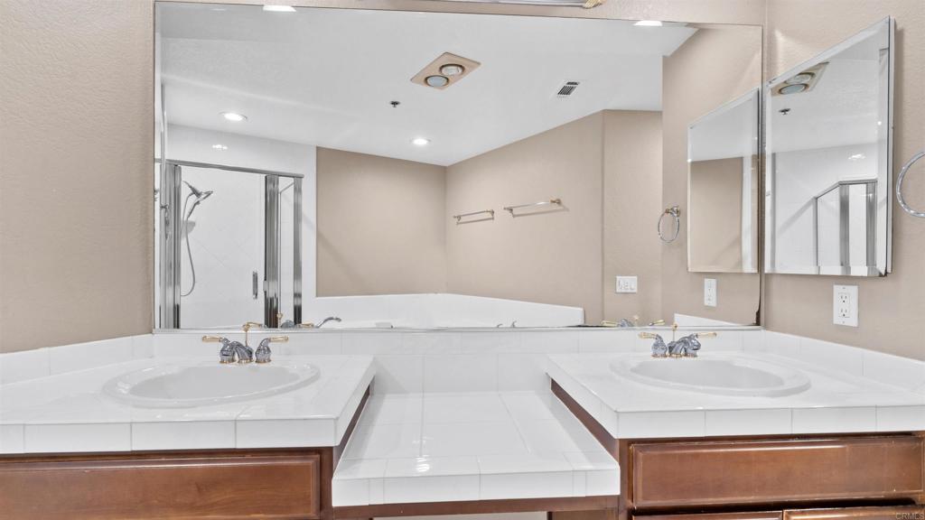 2894 Torrey Pines Road La Jolla, CA 92037 - Photo 24 of 46 a bathroom with a sink double vanity and a mirror