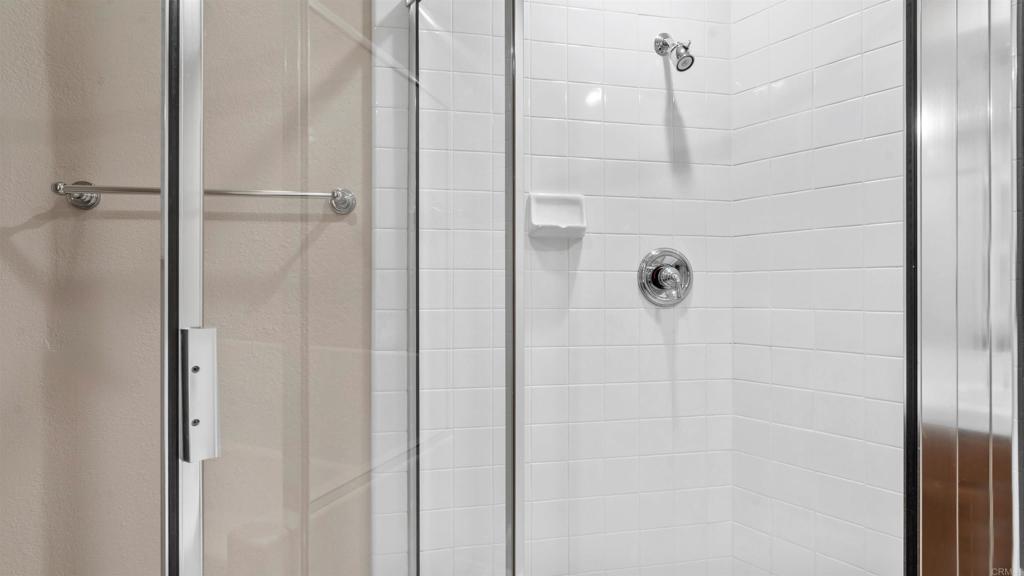 2894 Torrey Pines Road La Jolla, CA 92037 - Photo 34 of 46 a bathroom with a glass shower door