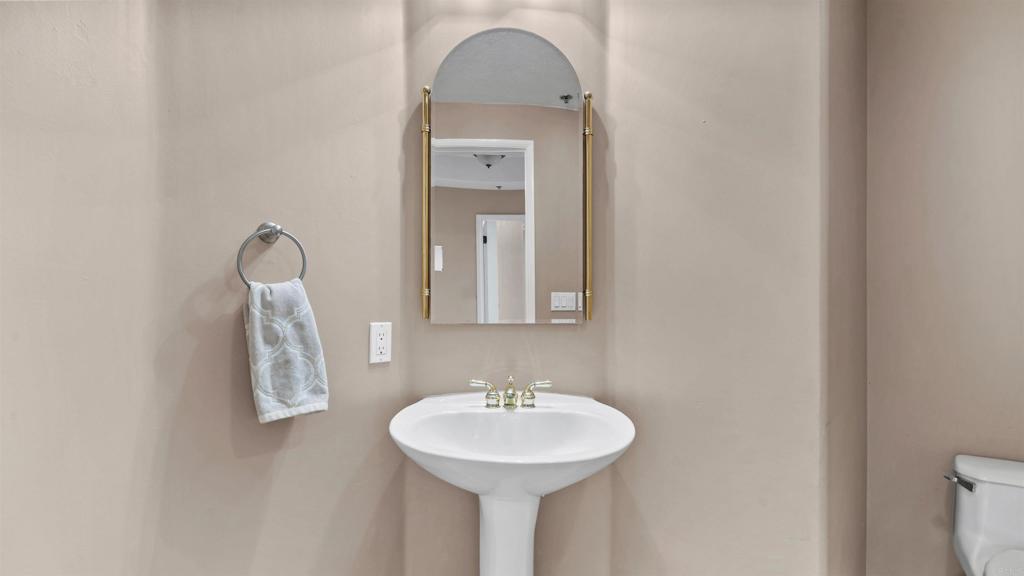 2894 Torrey Pines Road La Jolla, CA 92037 - Photo 38 of 46 a bathroom with a sink and a mirror