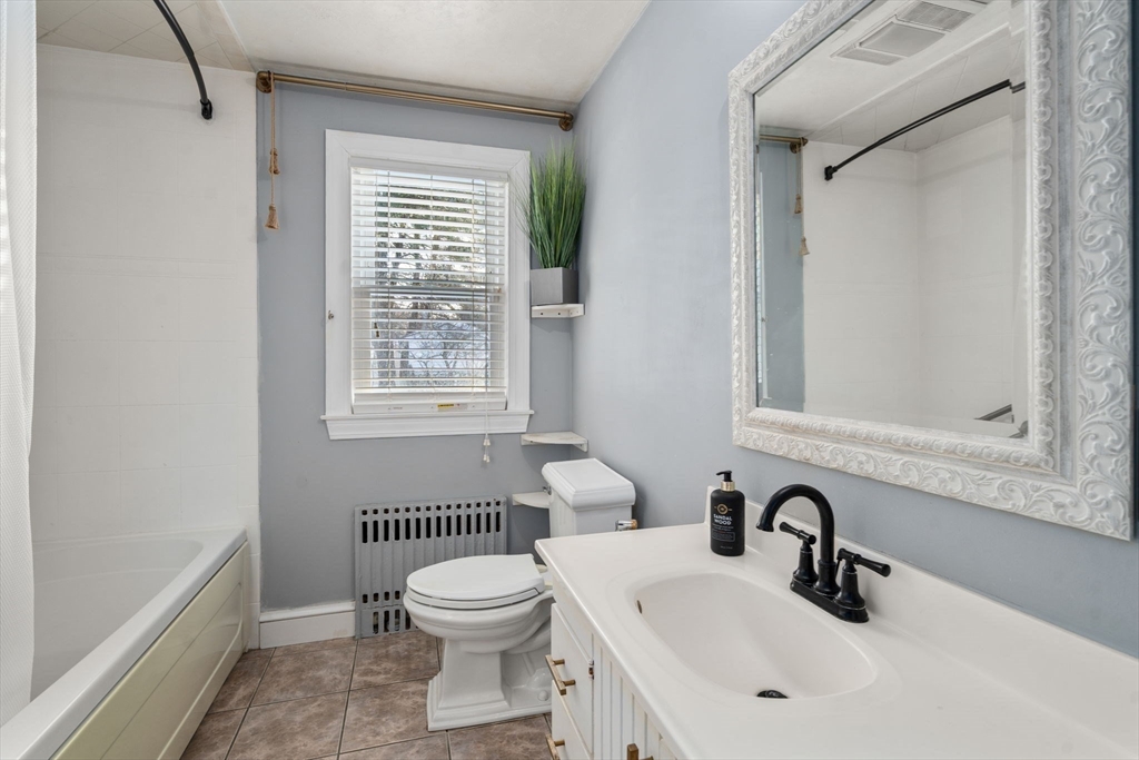 340 North Main Street Natick, MA 01760 - Photo 13 of 35 a bathroom with a sink a toilet and shower