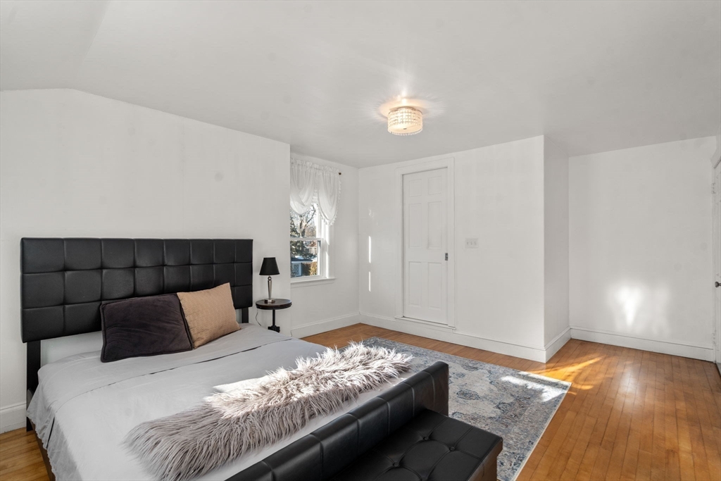340 North Main Street Natick, MA 01760 - Photo 17 of 35 a bedroom with a bed and window