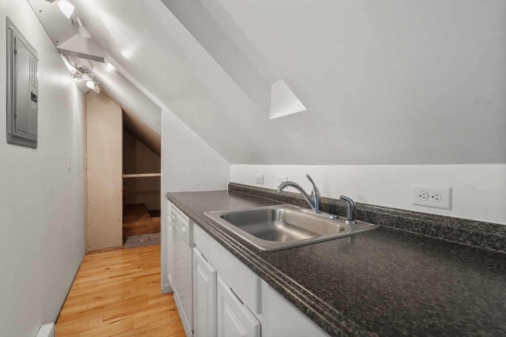 340 North Main Street Natick, MA 01760 - Photo 20 of 35 a kitchen with a sink and cabinets