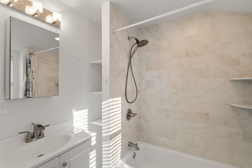 340 North Main Street Natick, MA 01760 - Photo 22 of 35 a bathroom with a sink a toilet and shower