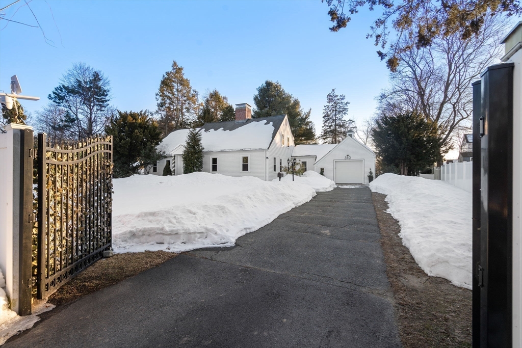 340 North Main Street Natick, MA 01760 - Photo 3 of 35 a view of a house with a snow in the yard