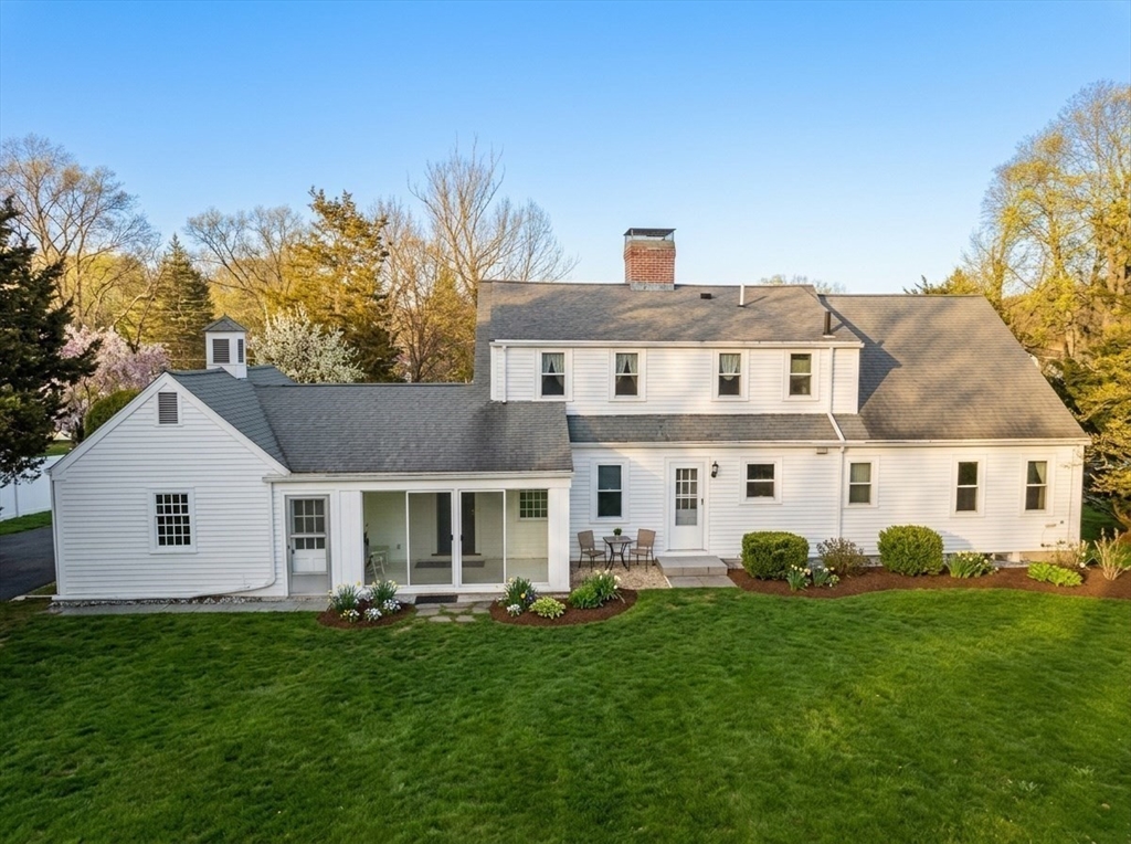 340 North Main Street Natick, MA 01760 - Photo 33 of 35 a front view of a house with a garden