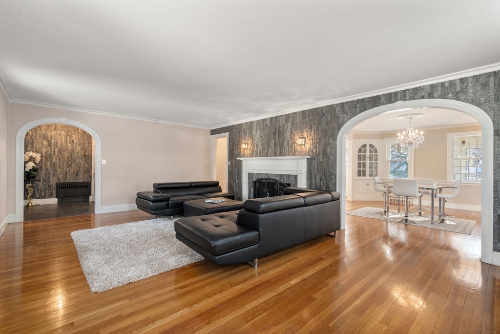 340 North Main Street Natick, MA 01760 - Photo 4 of 35 a living room with furniture and a fireplace