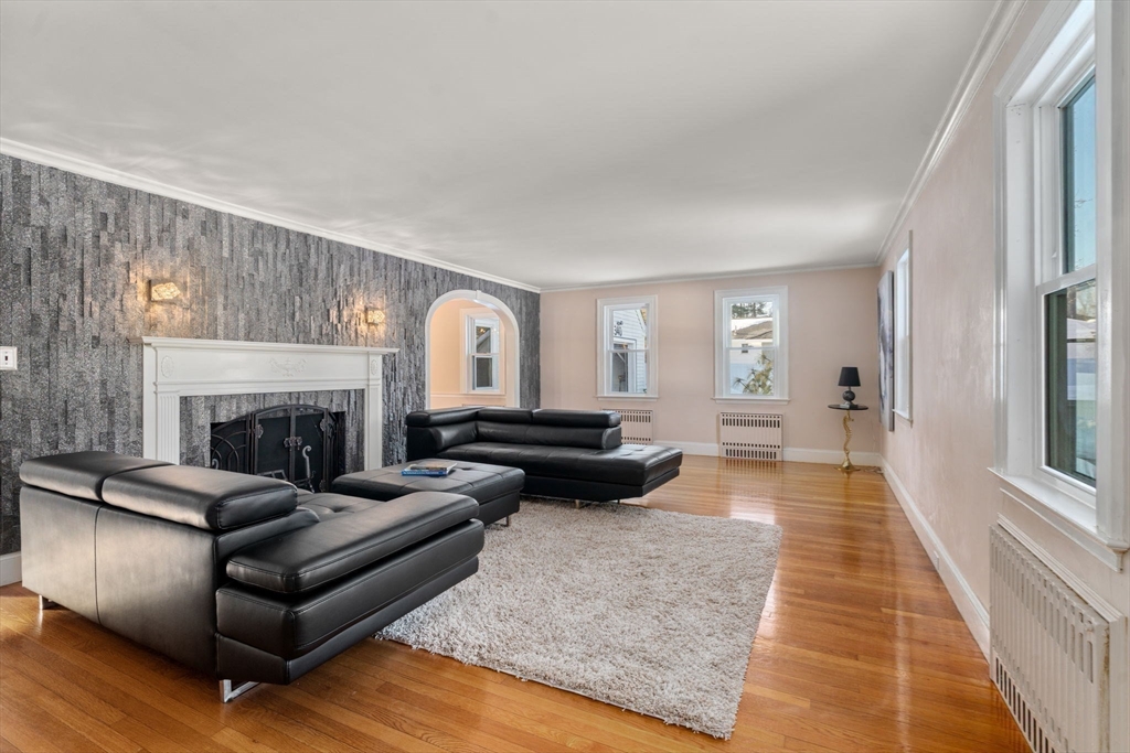 340 North Main Street Natick, MA 01760 - Photo 5 of 35 a living room with furniture and a fireplace