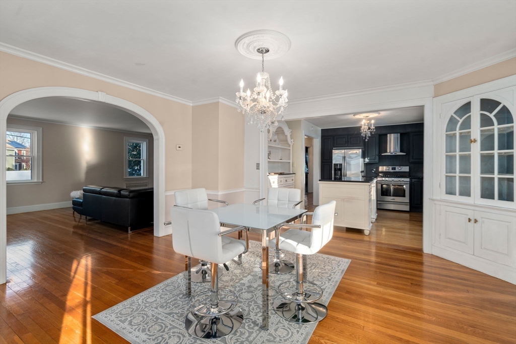 340 North Main Street Natick, MA 01760 - Photo 6 of 35 a view of a dining room with furniture and wooden floor