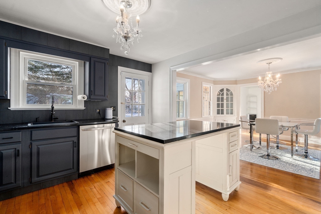 340 North Main Street Natick, MA 01760 - Photo 7 of 35 a kitchen with stainless steel appliances granite countertop stove top oven a sink and dishwasher