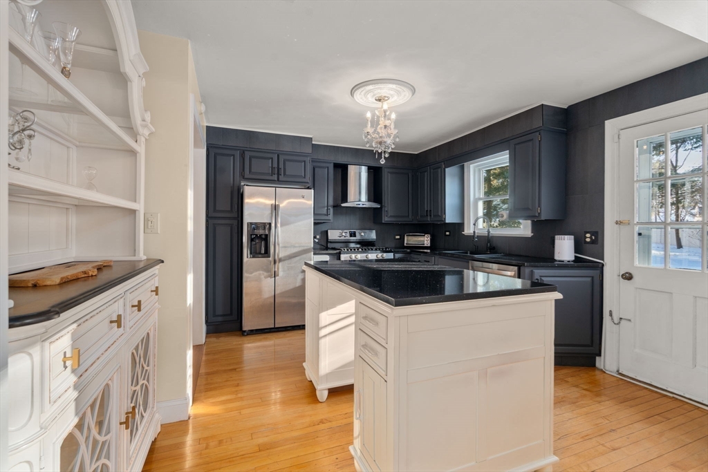 340 North Main Street Natick, MA 01760 - Photo 8 of 35 a kitchen with granite countertop a sink stove and refrigerator