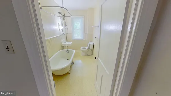 a bathroom with a tub and shower