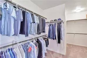 a spacious bathroom with a tub sink shower and mirror