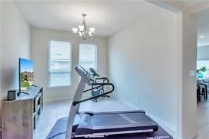 a view of walk in closet with clothes