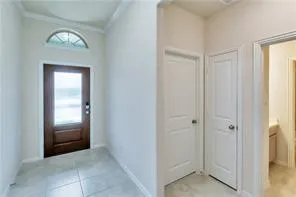 a view of a hallway with front door