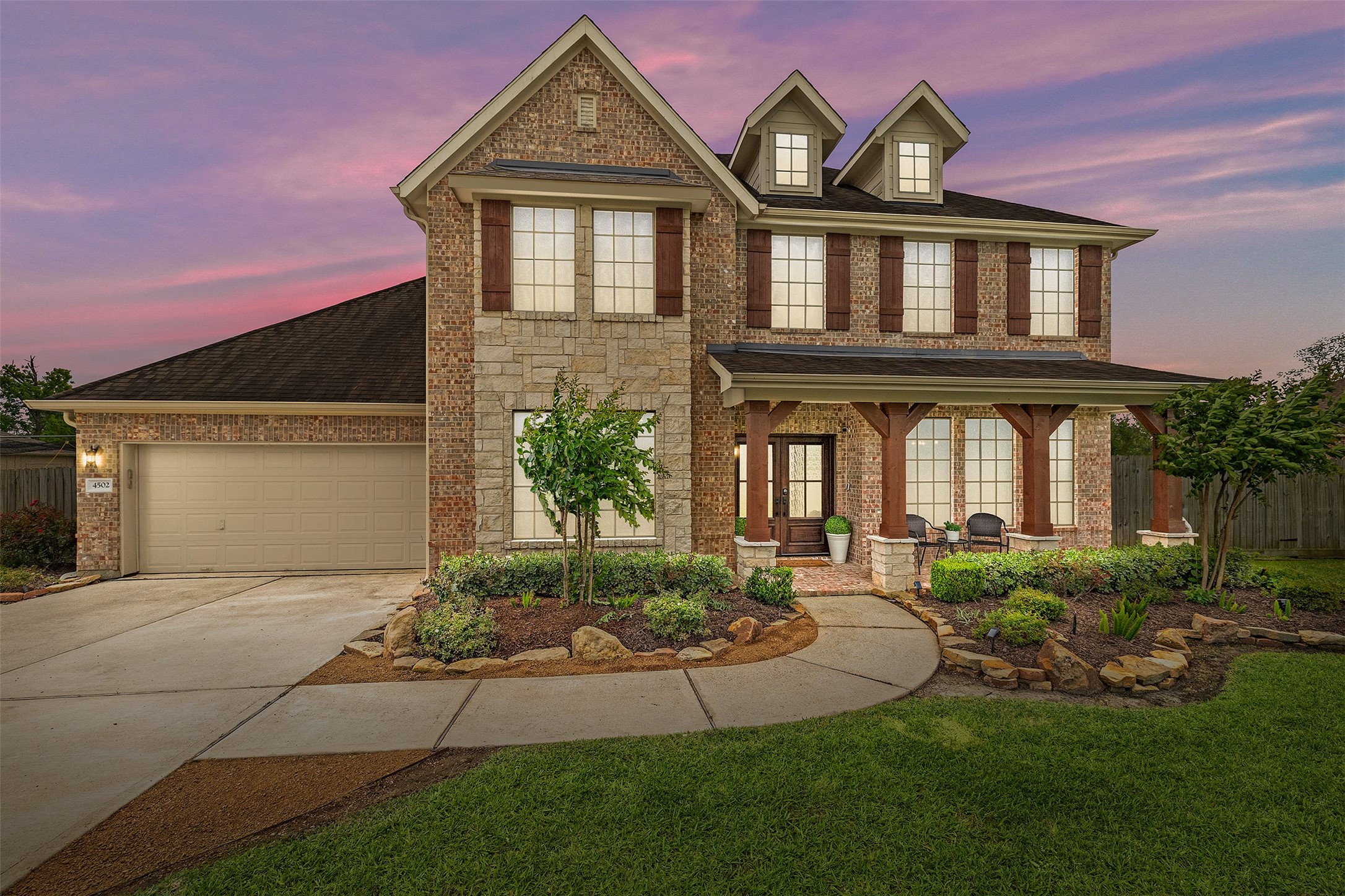 a front view of a house with garden