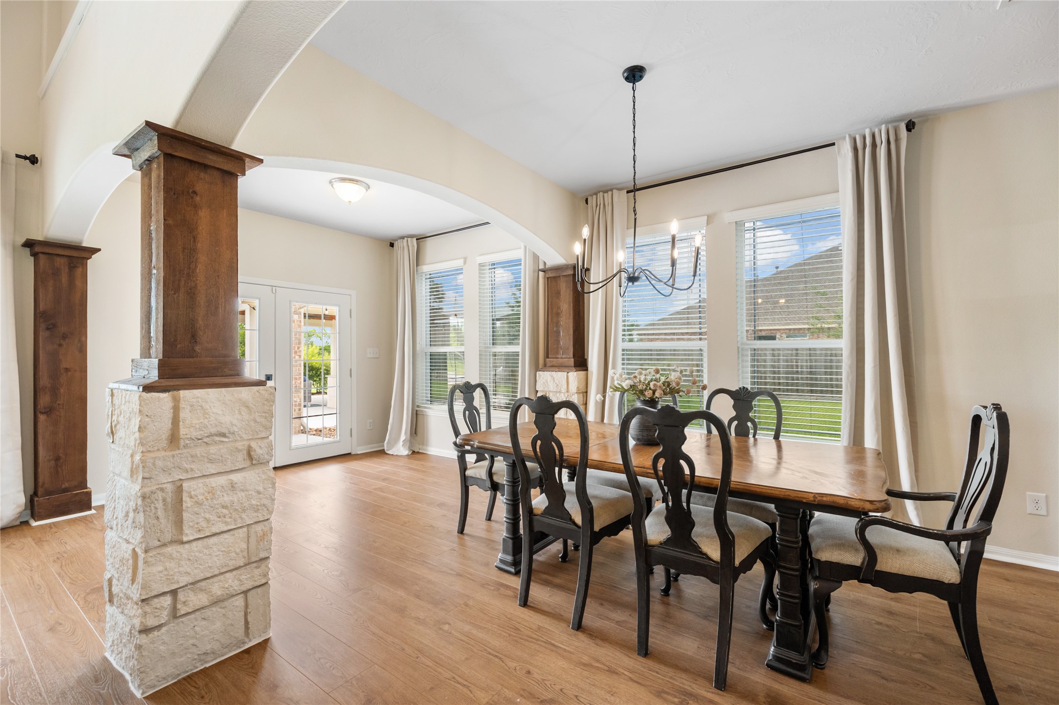 4502 Sunrise Road Baytown, TX 77523 - Photo 13 of 42 a view of a dining room with furniture window and wooden floor