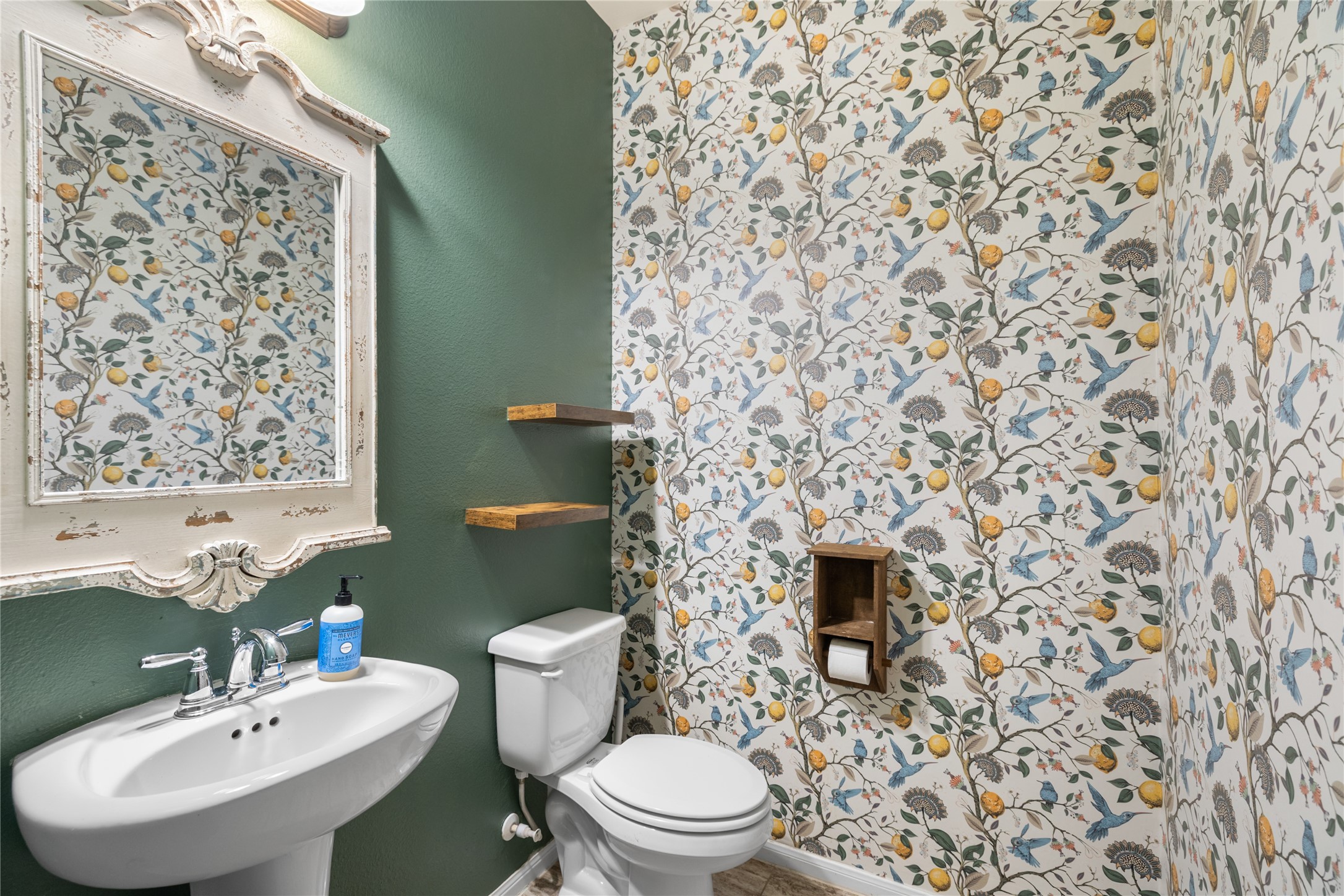 4502 Sunrise Road Baytown, TX 77523 - Photo 16 of 42 a bathroom with a sink toilet and mirror