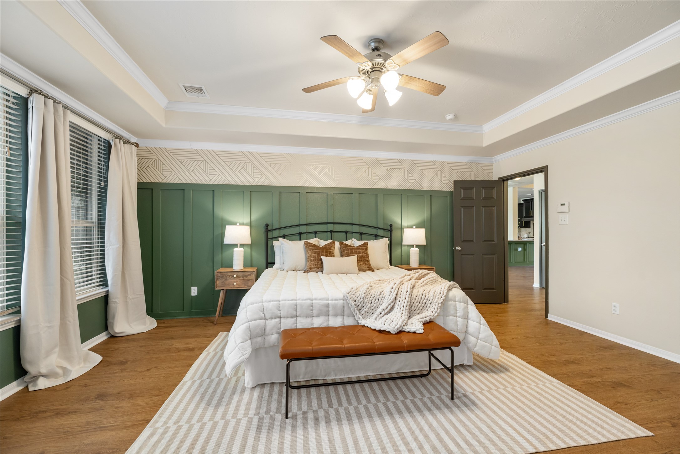 4502 Sunrise Road Baytown, TX 77523 - Photo 18 of 42 a bedroom with a bed and a chandelier