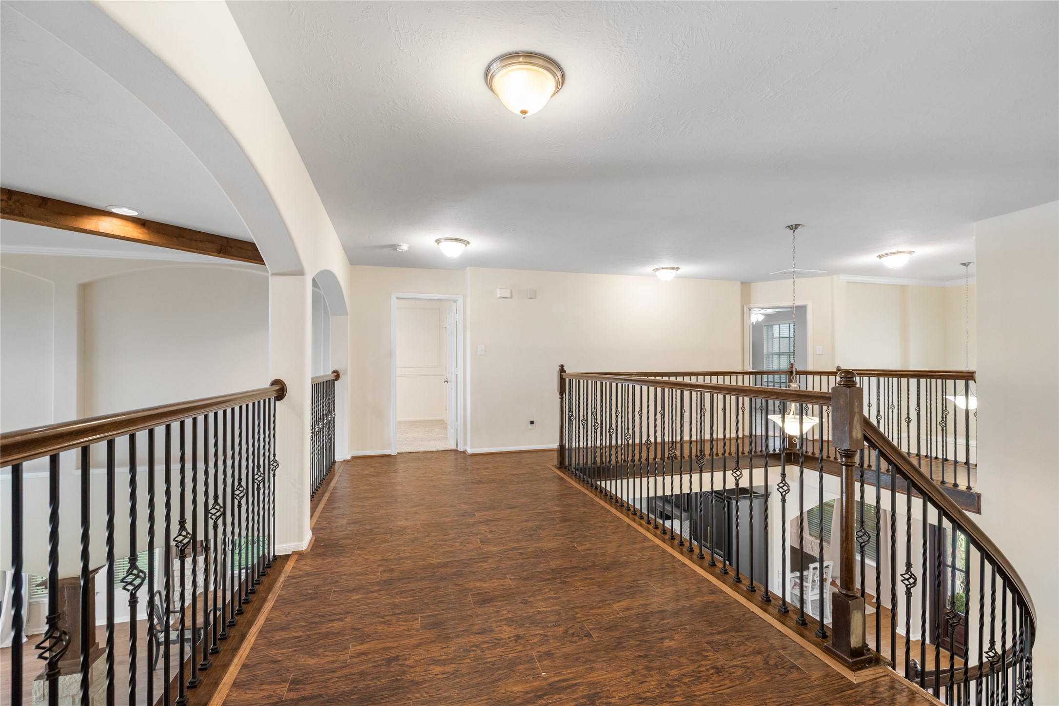 4502 Sunrise Road Baytown, TX 77523 - Photo 23 of 42 a view of a hallway with wooden floor