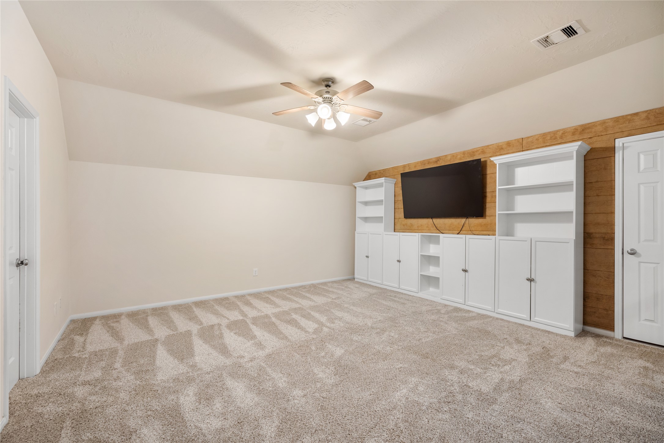 4502 Sunrise Road Baytown, TX 77523 - Photo 25 of 42 a view of an empty room with a flat screen tv