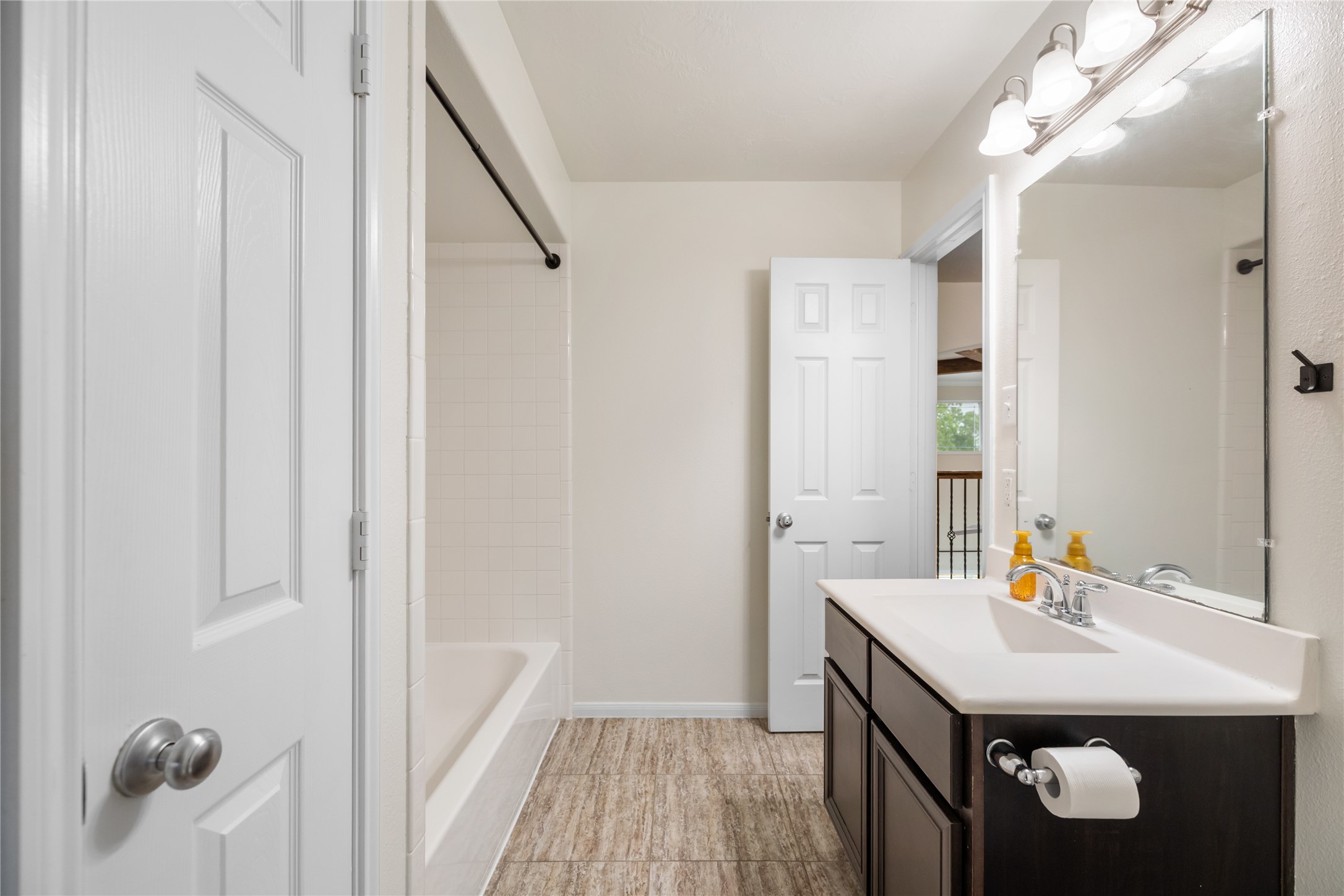 4502 Sunrise Road Baytown, TX 77523 - Photo 26 of 42 a bathroom with a sink a mirror a vanity and shower