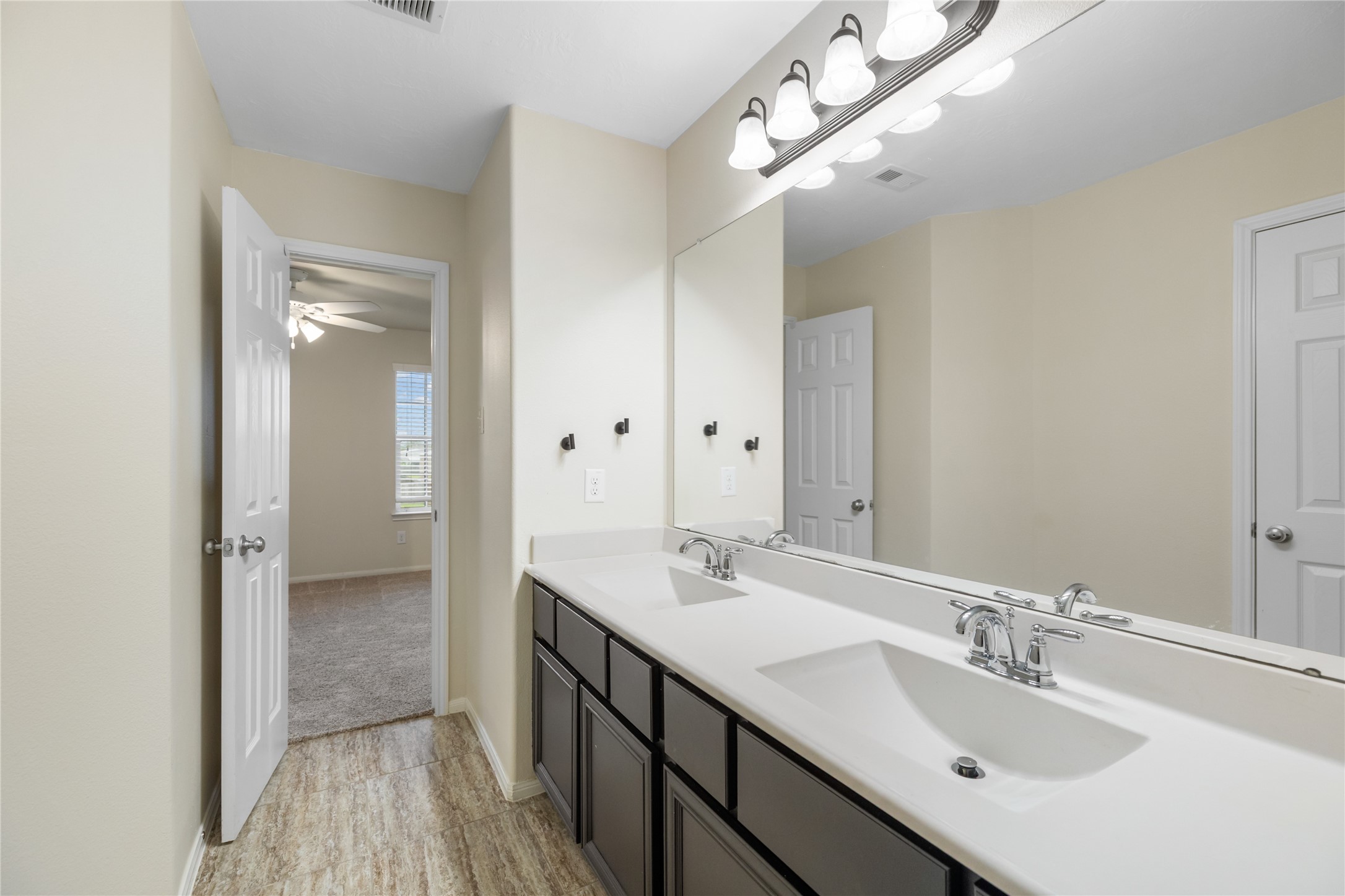 4502 Sunrise Road Baytown, TX 77523 - Photo 29 of 42 a bathroom with a sink double vanity and a mirror