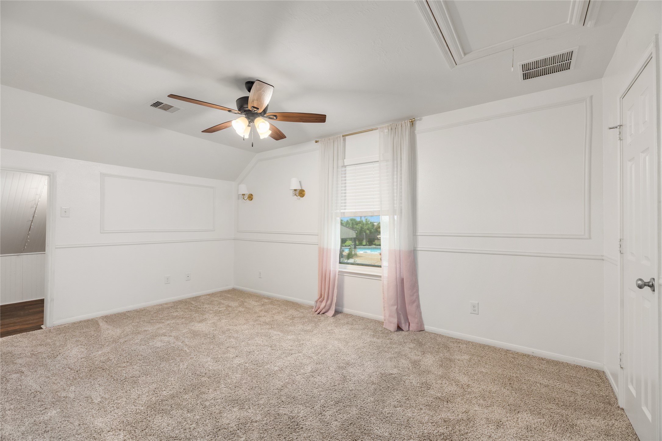 4502 Sunrise Road Baytown, TX 77523 - Photo 30 of 42 an empty room with closet and a chandelier fan