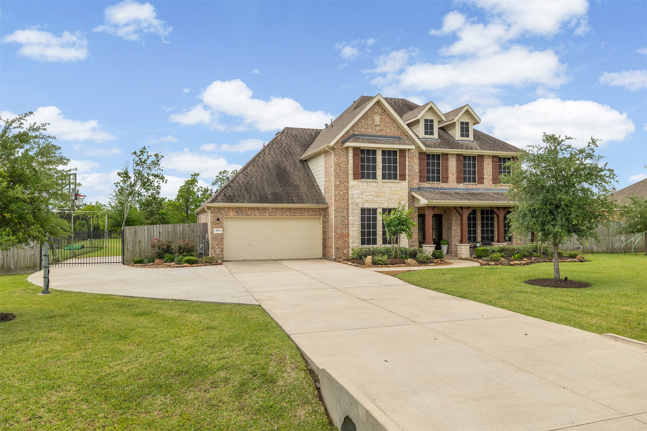 4502 Sunrise Road Baytown, TX 77523 - Photo 3 of 42 a view of a white house with a yard and potted plants
