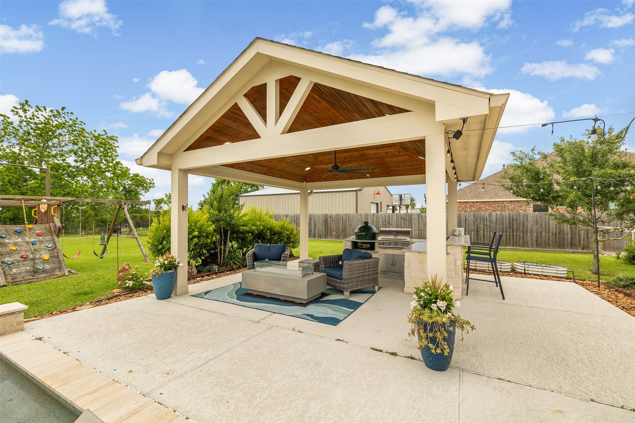 4502 Sunrise Road Baytown, TX 77523 - Photo 33 of 42 a view of a patio with a table and chairs